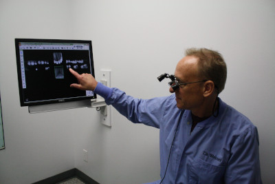 Dentist reviewing a digital x-ray at Lakewood Dental Arts in Lakewood, CA