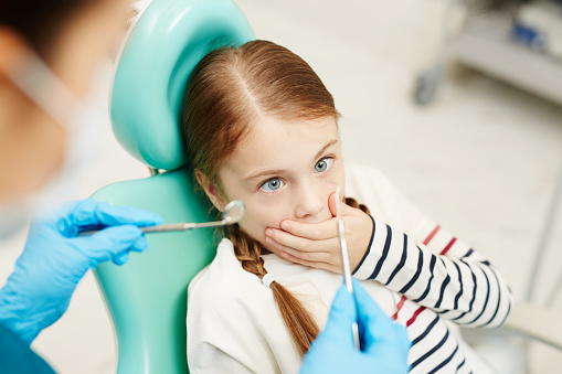 Image of a patient with dental anxiety before her dental checkup.
