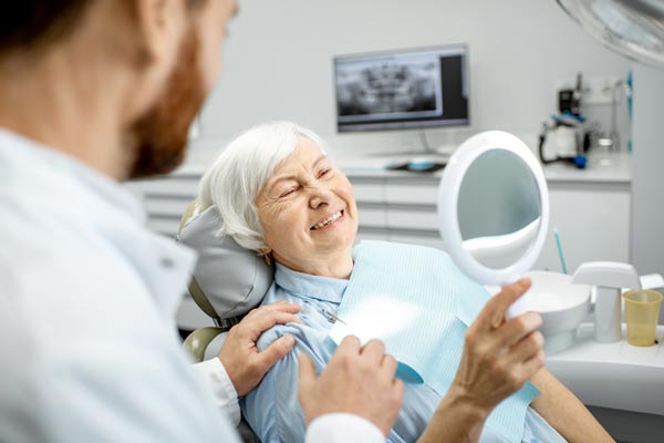 Elderly woman enjoying her new smile at Lakewood Dental Arts in Lakewood, CA